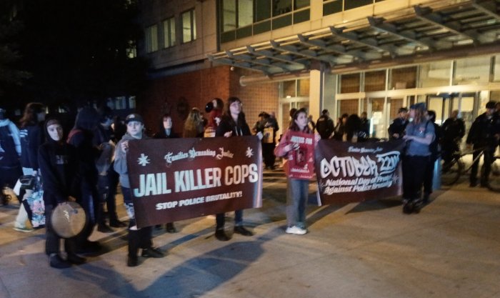 Protesters holding Families Demanding Justice banners at the October 22 National Day of Protest against police brutality in Chicago